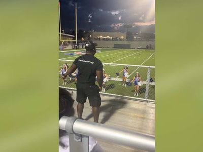 Dad joins in with daughter’s cheerleading squad from sidelines in show of support