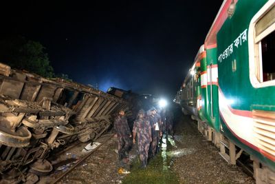 At least 15 killed and many injured when 2 trains collide in central Bangladesh