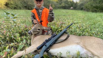 Young girl celebrates first deer