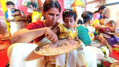 Children initiated into the world of learning on Vidyarambham in Thiruvananthapuram