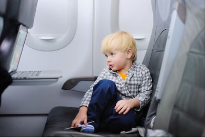 Passenger changing nappy on plane reignites child-free flights debate