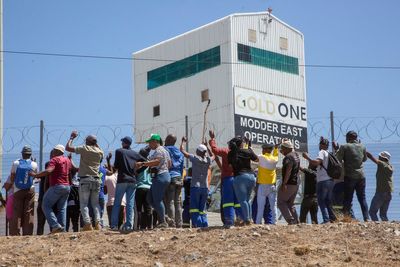 Police say miners from a rival union are holding hundreds of colleagues underground in South Africa