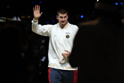 Nikola Jokic flashed a rare smile when presented with his first NBA championship ring