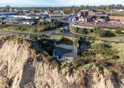 Home left metres from cliff edge after landslip in village with scrapped defence scheme