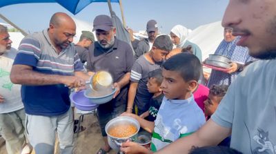 Displaced cook volunteers to feed 50 Gaza families amidst Israeli bombing