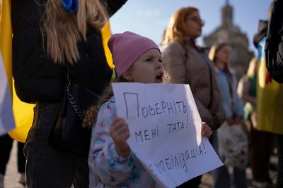 War-weary mothers, wives and children of Ukrainian soldiers demand a cap on military service time