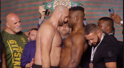 Video: Tyson Fury leans into Francis Ngannou during spirited final faceoff at weigh-ins