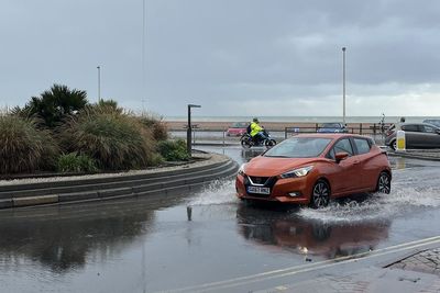 Flood alerts as heavy rain sweeps in after ‘tornado’ hits south coast