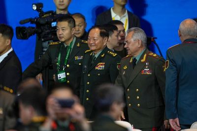At China military forum, Russian defense minister accuses the US of fueling geopolitical tensions