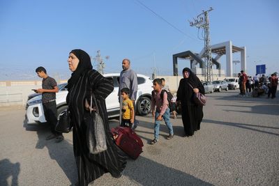 Hundreds fleeing Gaza gather at border as Egypt opens Rafah crossing for first time since 7 October