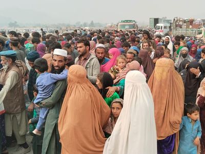 ‘Where do I go back to?’: Expelled Afghans battle chaos at Pakistan border