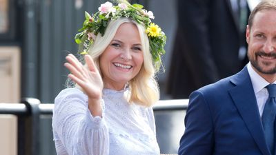 Crown Princess Mette-Marit just wore the most fabulous floral print gown that's perfect for winter- and her shoulder cape was so chic