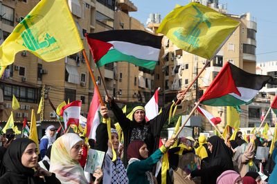 Thousands gather for Hezbollah leader’s first speech on Israel-Hamas war – and hear little but threats