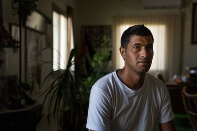As Israel forces workers from Gaza back, thousands more remain stuck in the West Bank