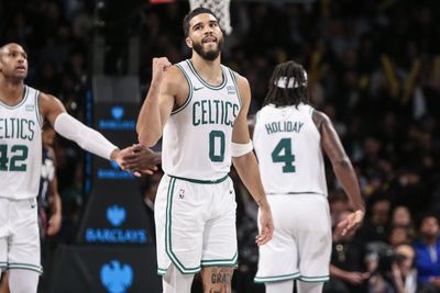 Jayson Tatum reacts to reaching 10,000 career points with the Boston Celtics
