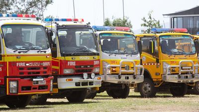 Man accused of stealing two fire trucks as Qld burns