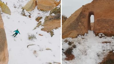 Watch skier thread his way through tiny gap in the rock on snowy MTB trail