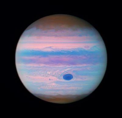 Jupiter Resembles A Bubblegum Ball In Hubble’s New Ultraviolet Image