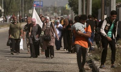 ‘We saw death’: families flee past tanks as Israel begins to storm Gaza City