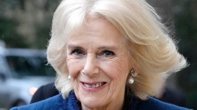Queen Camilla's electric blue lace dress perfectly complements her icy blonde bob for special outing