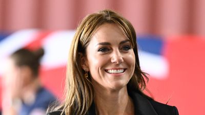 Kate Middleton’s chic all black ensemble features the most stunning gold buttoned blazer and her side parting is perfection