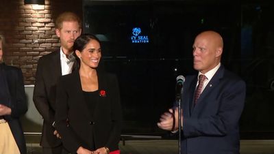 Prince Harry and Meghan wear poppies as they visit US veterans in San Diego