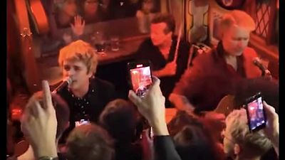 "We are Green Day, and this one's called Welcome To Paradise": Watch Green Day play a surprise secret acoustic show in a London pub