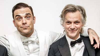 Which of Robbie Williams' songs did Guy Chambers write and why did he and Robbie split?