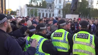 People shouting 'England 'til I die' clash with police near Cenotaph