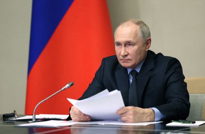 Putin approves new media restrictions ahead of presidential election
