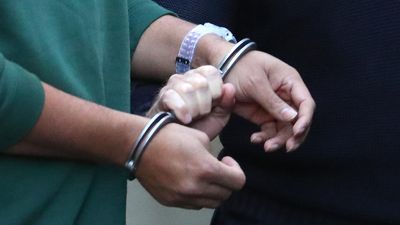 Asylum seeker settles handcuff case against Serco, govt