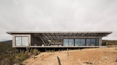 This Chilean beach house comprises a series of pavilions set beneath a wooden roof