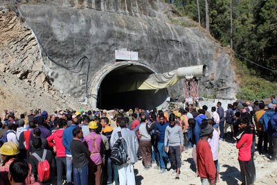 Indian rescuers prepare to drill to reach 40 workers trapped in a collapse tunnel since weekend