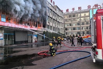 Fire at a coal mining company building in northern China kills 26 and injures dozens