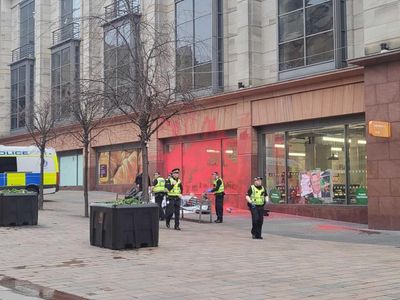 Four arrested after protesters glue themselves to ground in Glasgow street