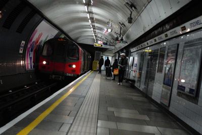 Hunt for man who tried to push woman in front of train at Leicester Square Station