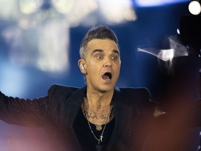 Robbie Williams fan fighting for life after horror fall during pop star’s concert