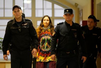 Russian artist jailed for staging anti-war supermarket protest as Putin pardons murderer of Kremlin-critic