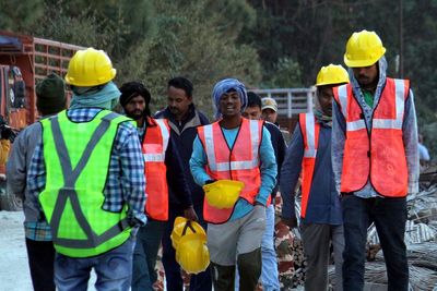 In India, 40 workers are trapped in a tunnel for a 7th day as rescuers wait for a new drill