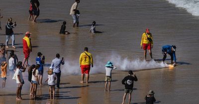 Nobbys Beach briefly emptied as signalling canister floats ashore from RAAF Air Show