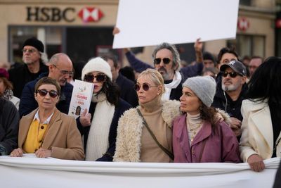 French performers lead a silent Paris march for peace between Israelis and Palestinians