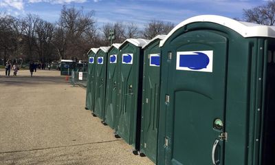 Suspected car thief caught in portable toilet after bystanders push it over