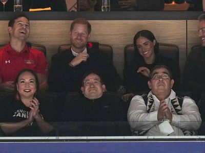 Prince Harry and Meghan Markle let loose with victory dance during ice hockey game