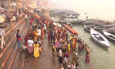 Varanasi: Devotees take holy dip in river Ganga on the occasion of 'Ekadashi'