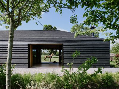 Arc Polo Farm’s charred timber clubhouse underpins its updated Surrey complex