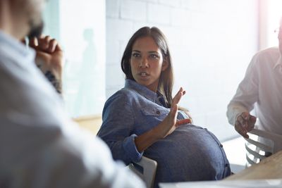 Motherhood penalty laid bare: From co-workers comparing pregnant colleagues to broken race cars to senior women 'hazing' other moms