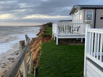 Residents evacuated after clifftop road falls into sea in Suffolk