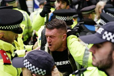 Police arrest Tommy Robinson at London antisemitism march