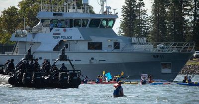 Two plead guilty after more than 100 charged over port protest