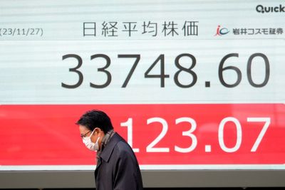 Stock market today: Asian shares mostly decline, as investors watch spending, inflation